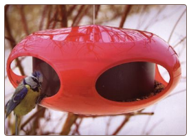Retro wild bird feeder resembles a spaceship