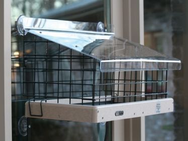 Innovative Cage Add-On Make these window bird feeders squirrel resistant