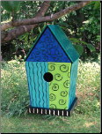 a real glass bird feeder is rare, but here's a fused glass on a wooden nest box