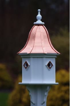 Find four entrances and matching portals on this copper roof birdhouse