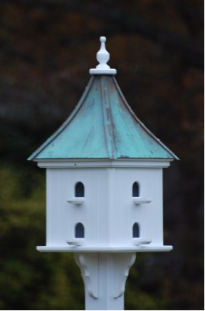 Eight entrances with perches and patina roof complete this unique copper roof birdhouse