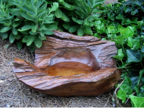 Natural materials and elements create  unique bird baths to meld with nature.