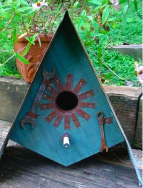 Reclaimed Materials are usedto craft this vintage decorative birdhouse