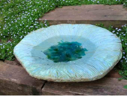 Gentle sloped sides on this birdbath make it easy for birds to walk right out